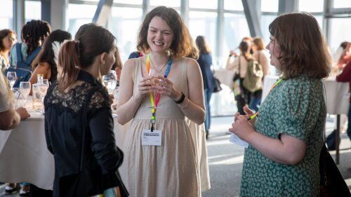 Attendees of the 2025 Women in Photonics workshop connect.