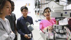 ASP doctoral candidates discuss an experimental setup in the ACP labs.